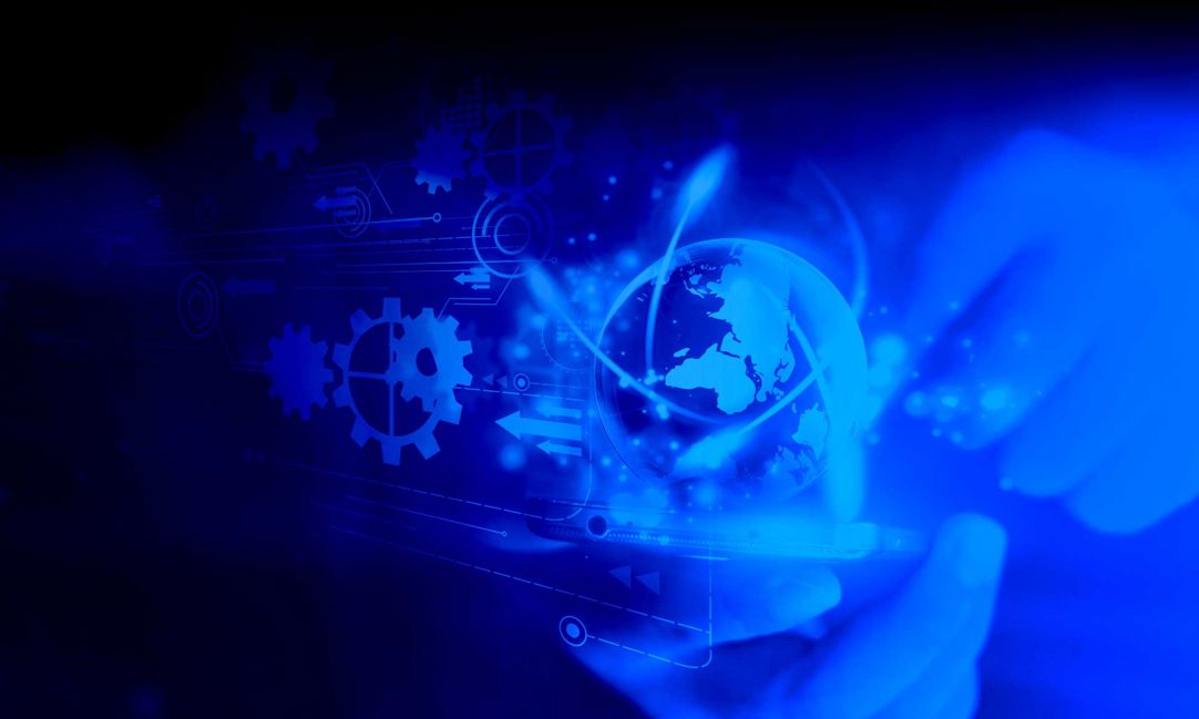 hands cradle a smart phone with holographic overlays of gears and globes and other elements on a blue tinted background